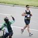 A runner is cheered on by a passing by cyclist during the Ann Arbor Marathon on Sunday, June 9. Daniel Brenner I AnnArbor.com